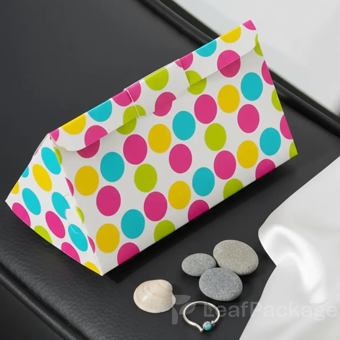 Eco-friendly custom triangle fold card box made from recyclable paper, ideal for creative product packaging and small business branding.