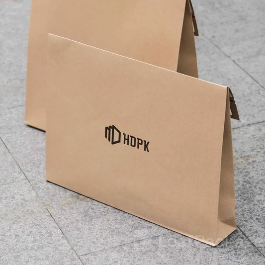 Expandable kraft envelopes made from recyclable paper, great for clothing, books, and retail shipping.