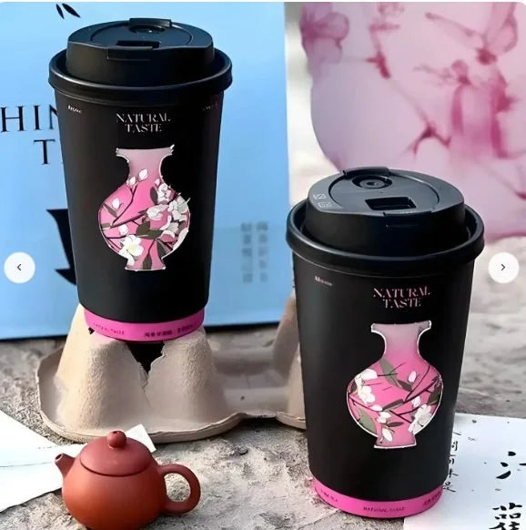 Custom printed takeaway cups on a café counter