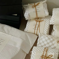 Plastic-free biodegradable honeycomb cushion paper designed to replace bubble wrap and protect fragile products during transport.