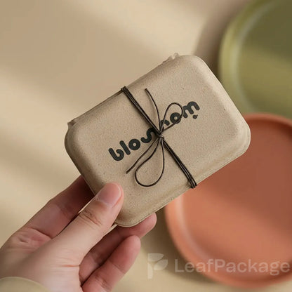 Eco friendly custom biodegradable gift box made from recyclable materials, perfect for small businesses looking for sustainable and elegant packaging.