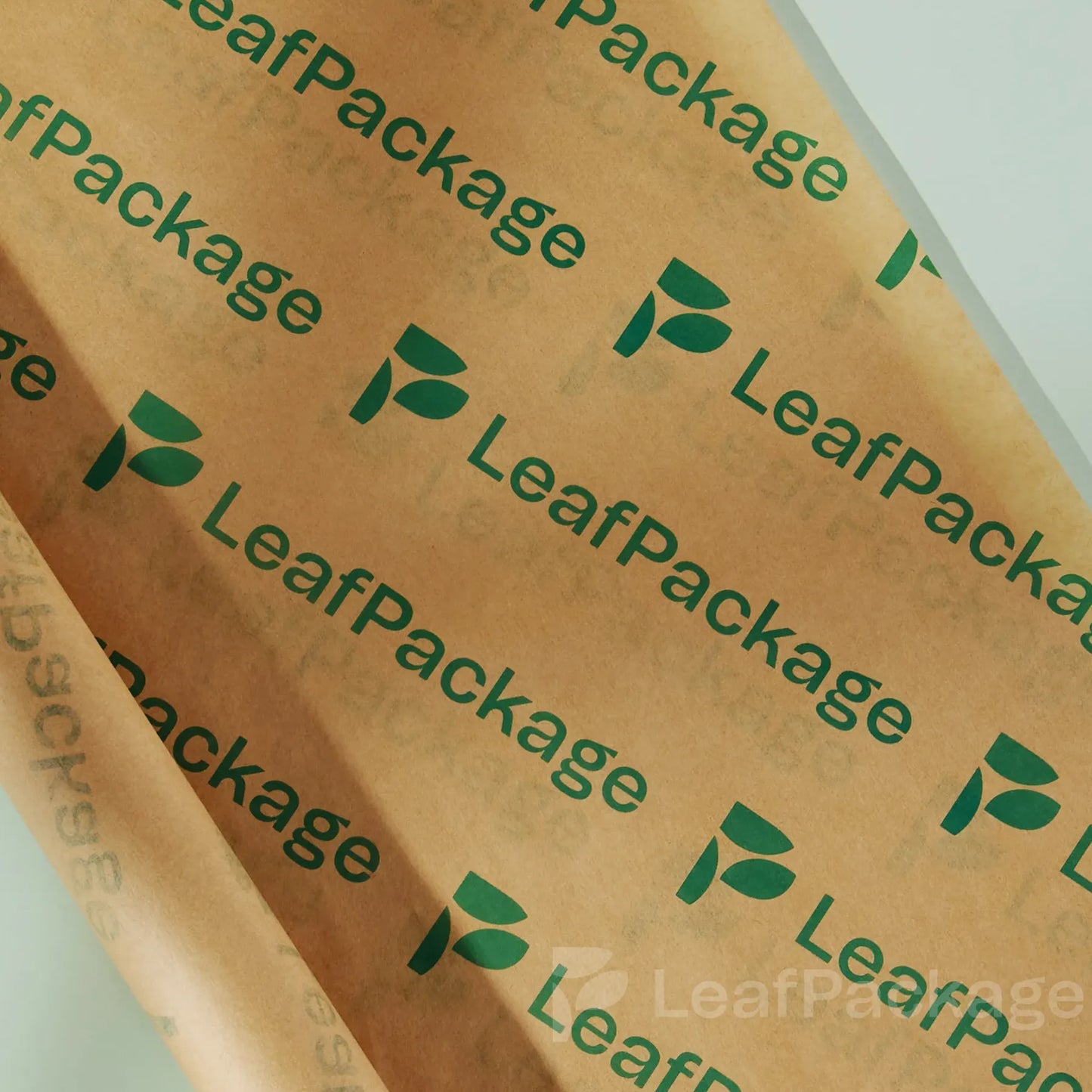 LeafPackage custom printed food wrapping paper made from biodegradable material, perfect for cafes, bakeries, and restaurants. Add your brand logo for sustainable and stylish food packaging.