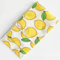 Eco-friendly custom beeswax food wrap made from organic cotton and natural beeswax, ideal for wrapping fruits, sandwiches, and leftovers in a plastic-free way.
