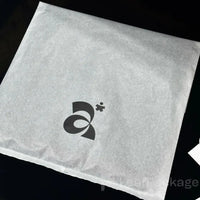 Recyclable garment bags made from lightweight tissue paper, available in bulk for small businesses.