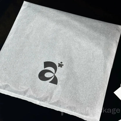 Recyclable garment bags made from lightweight tissue paper, available in bulk for small businesses.