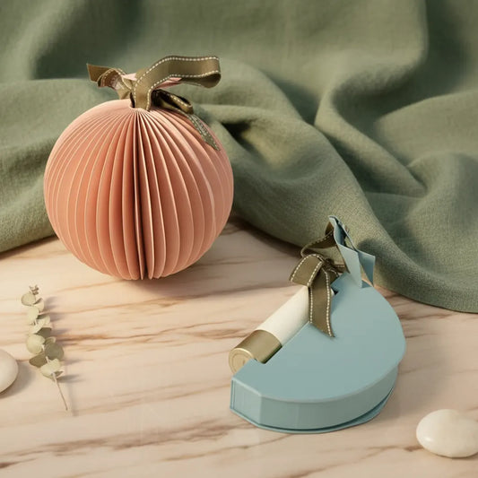 Creative lipstick packaging shaped like a spherical lantern, ideal for cosmetic brands seeking distinctive, sustainable paper box designs.