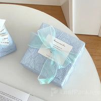 Elegant stone-textured wrapping paper designed for brands seeking a sophisticated and sustainable packaging solution made from recyclable materials.