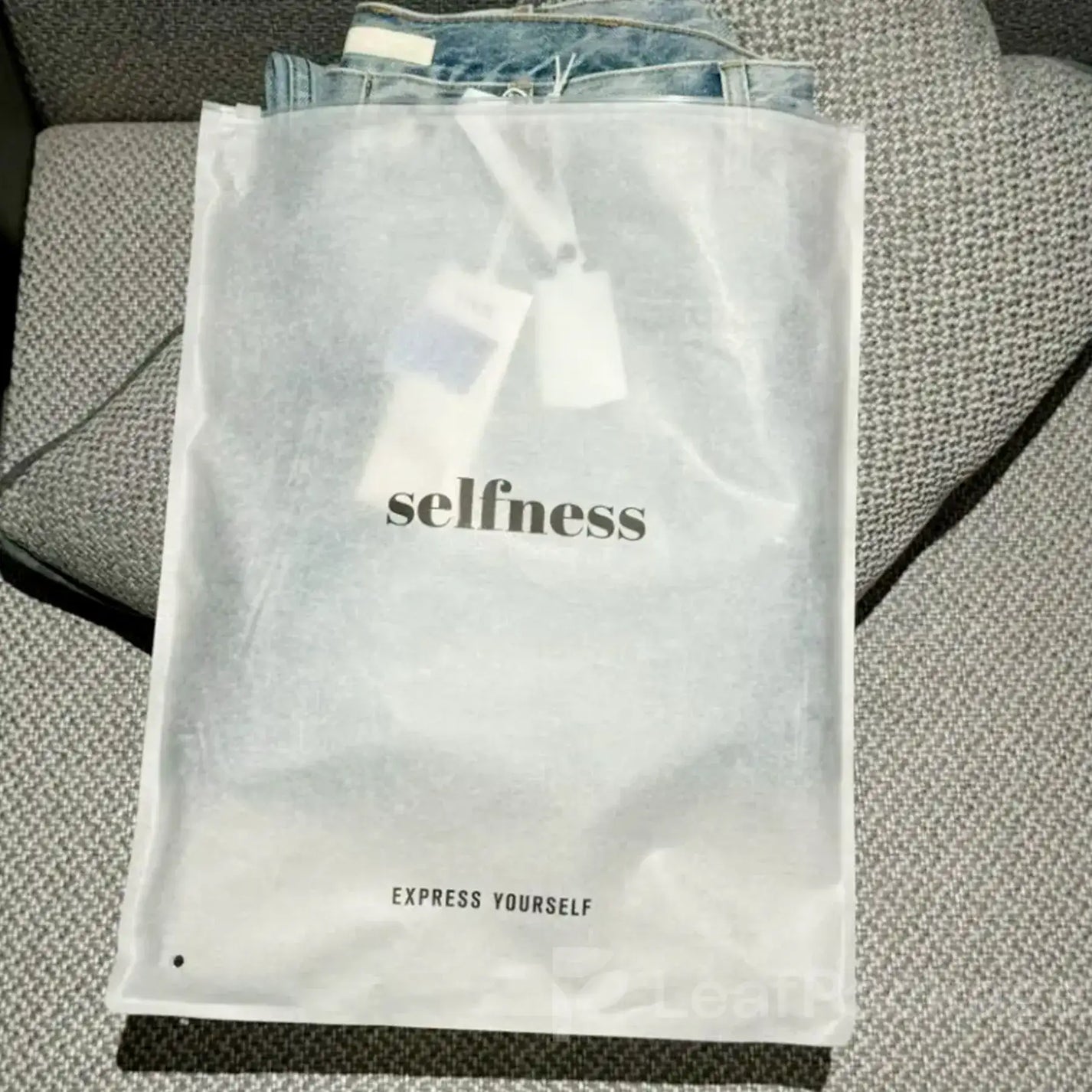 Custom printed tissue paper garment bags with logo, enhancing brand identity for fashion and retail stores.