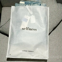 Custom printed tissue paper garment bags with logo, enhancing brand identity for fashion and retail stores.
