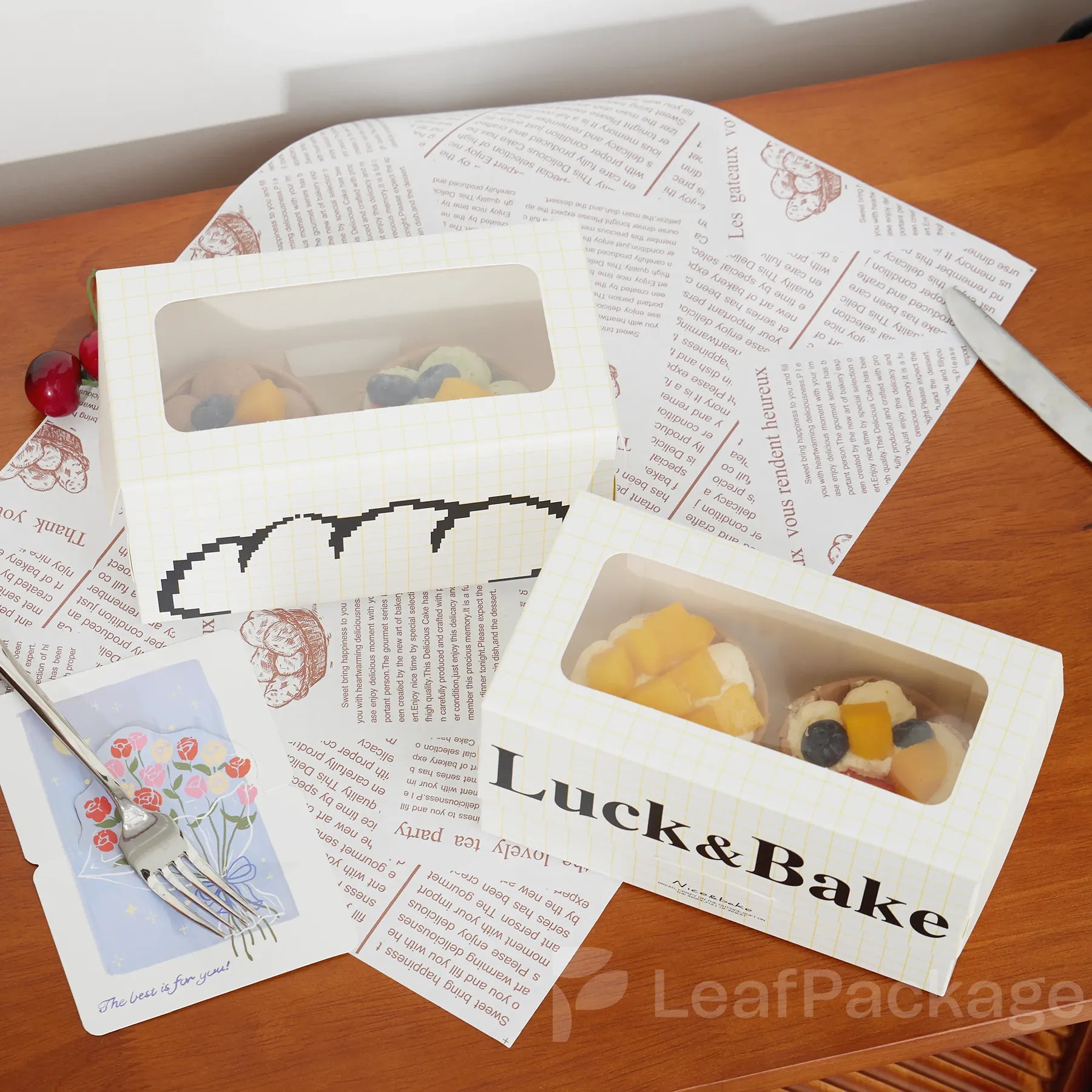 Sustainable kraft cake boxes with clear window design from LeafPackage, showcasing cakes beautifully while supporting eco packaging goals.