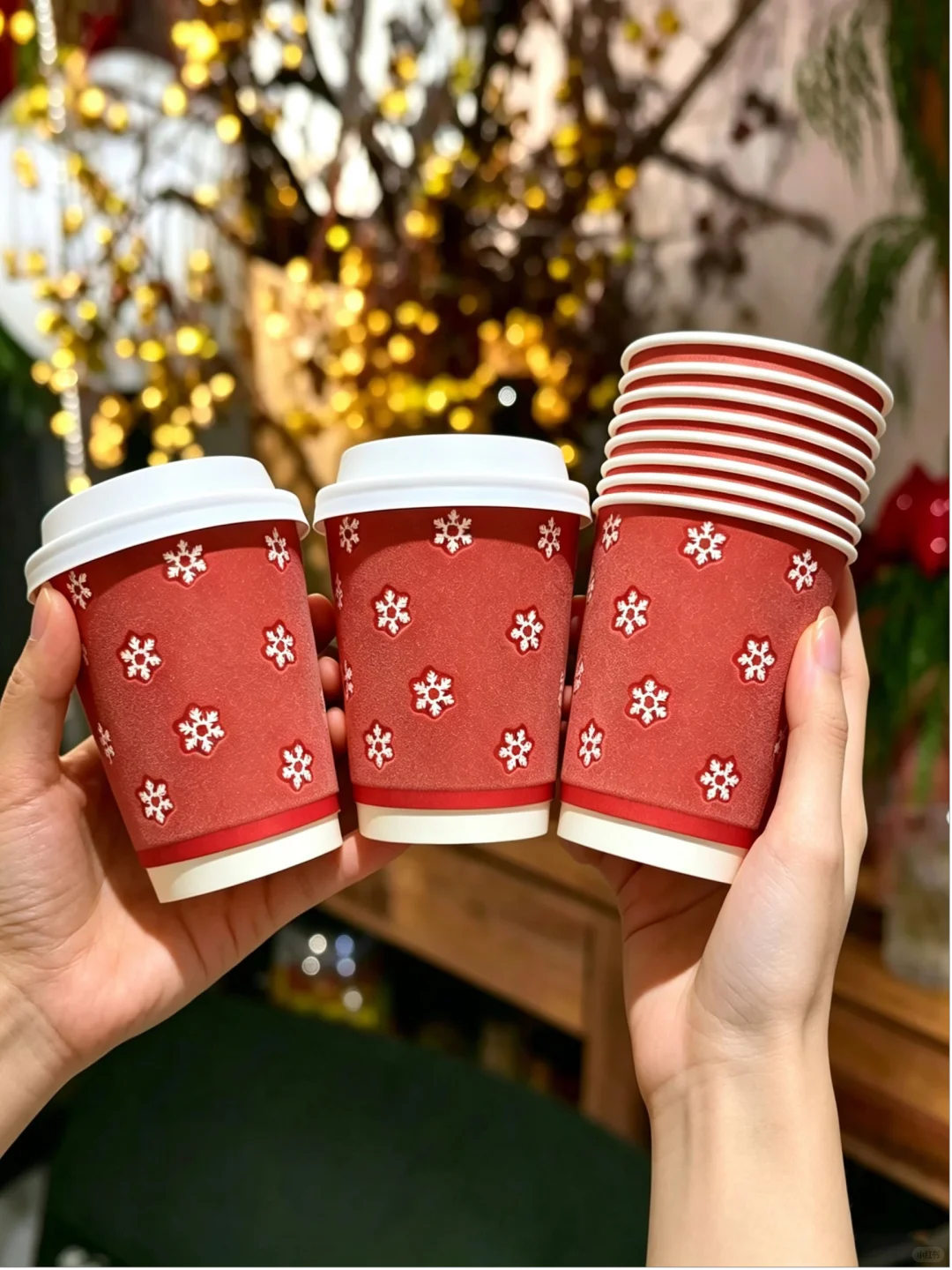 Red Christmas foam insulated paper cups with white snowflake designs