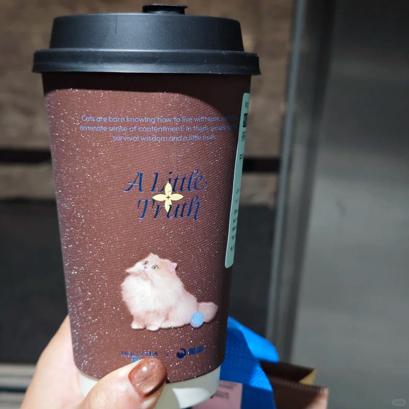 Custom glitter paper coffee cup with a sparkling finish and printed artwork