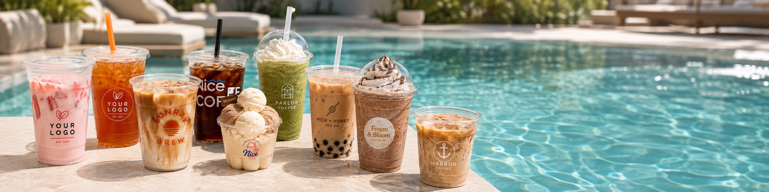 Custom printed cold drink cups for iced coffee, smoothies, bubble tea, and desserts beside a summer pool